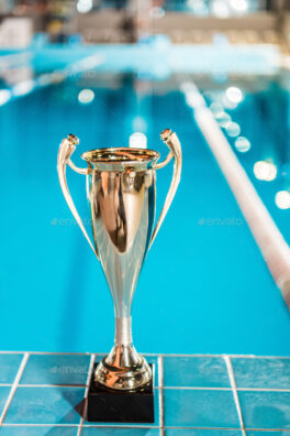 golden trophy cup at competition swimming pool